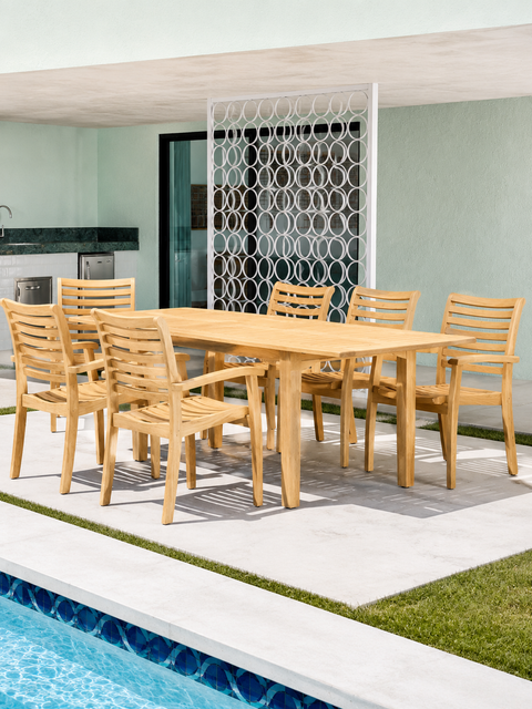 Manorhouse extendable teak outdoor dining table on a garden patio