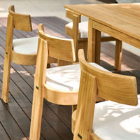 Canvas Forma dining chair in an outdoor poolside setting