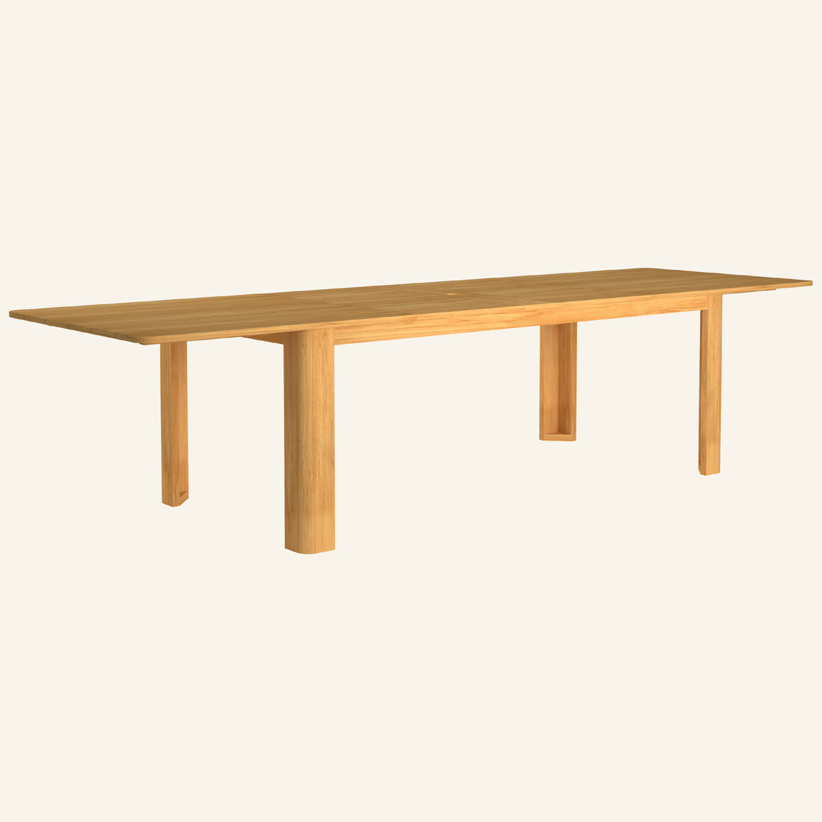 Forma dining table in the extended position, solid teak tabletop and base