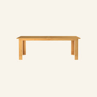 Forma dining table from the front, solid Grade-A teak tabletop and base