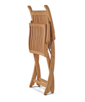 Teak armchair folded for compact storage, showcasing its easy-to-use collapsible design for practical functionality.