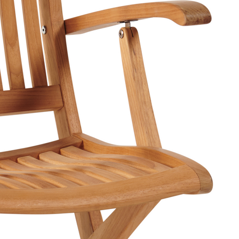 Close-up view of the armrest and slatted seat of the teak chair, emphasizing its craftsmanship and smooth, rounded edges.