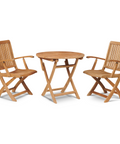 A charming bistro set featuring a round teak table and two matching slatted armchairs, ideal for intimate outdoor dining or relaxation.