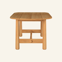 Isla oval dining table from the side, solid teak tabletop and base
