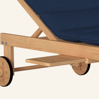 Lance sunlounger in navy, detail of teak grain and joinery