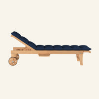 Lance sunlounger in navy, side profile in solid teak