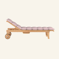 Lance sunlounger in pink, side profile in solid teak