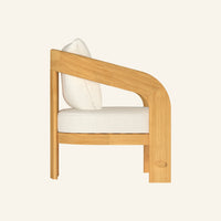 Mira lounge chair, side profile showing solid teak construction