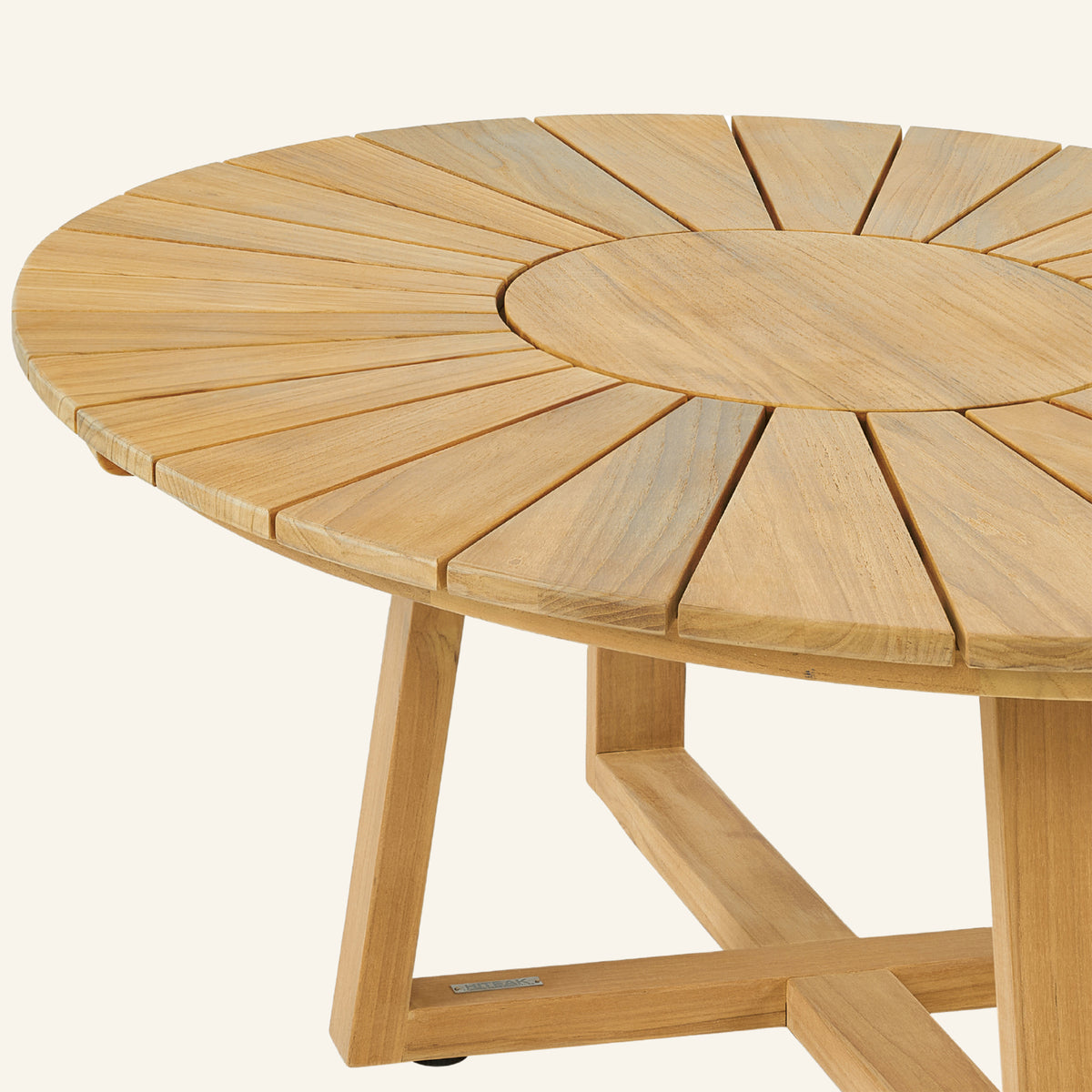 Solis coffee table close-up, teak grain across the tabletop edge