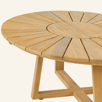 Solis coffee table close-up, teak grain across the tabletop edge
