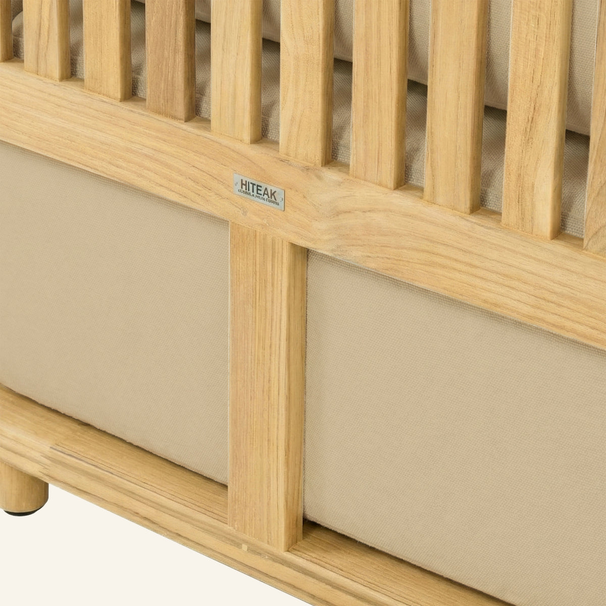 Solis sofa detail in Camel, cushion edge against the teak frame