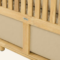 Solis sofa detail in Camel, cushion edge against the teak frame