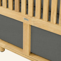 Solis sofa detail in Charcoal, cushion edge against the teak frame