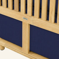Solis sofa detail in Navy, cushion edge against the teak frame