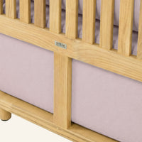 Solis sofa detail in Pink, cushion edge against the teak frame